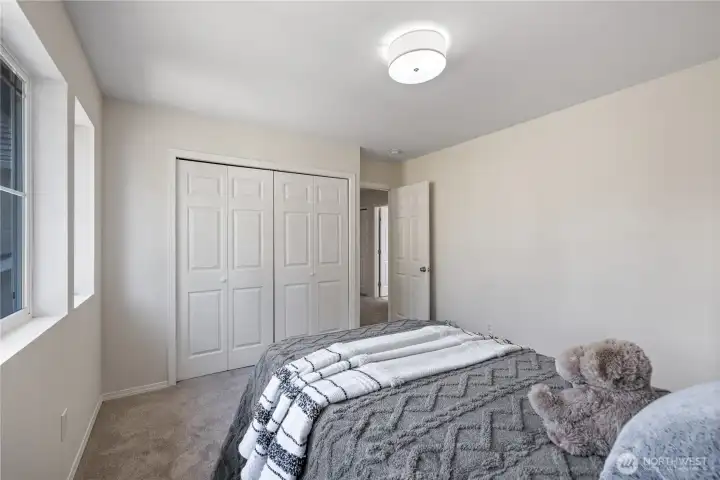 Second bedroom with brand new carpet and flooding with nautral light.