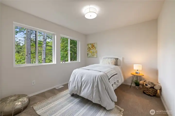 Third bedroom showing the greenbelt views right out the window — a peaceful place to wake up