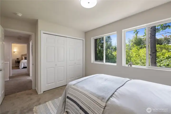 dditional bedroom angle showing the natural light and how large the closet opening is