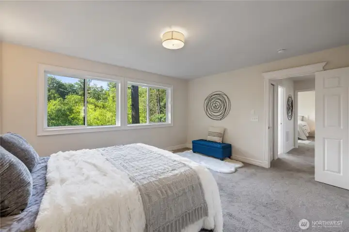 Second angle of the primary showing how spacious it is with room for a full furniture set