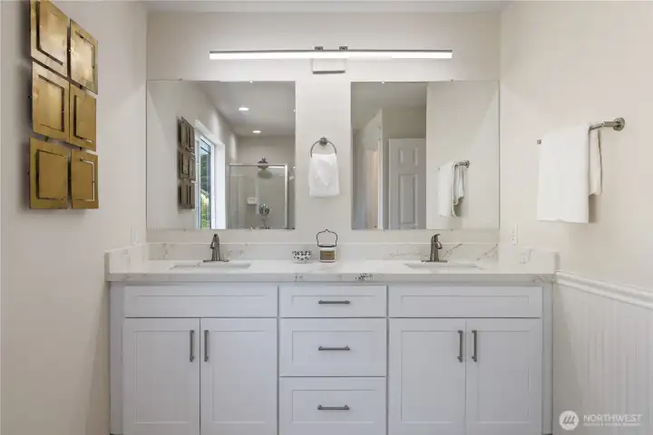 Updated vanity with dual sinks and modern white cabinetry — lots of counter space
