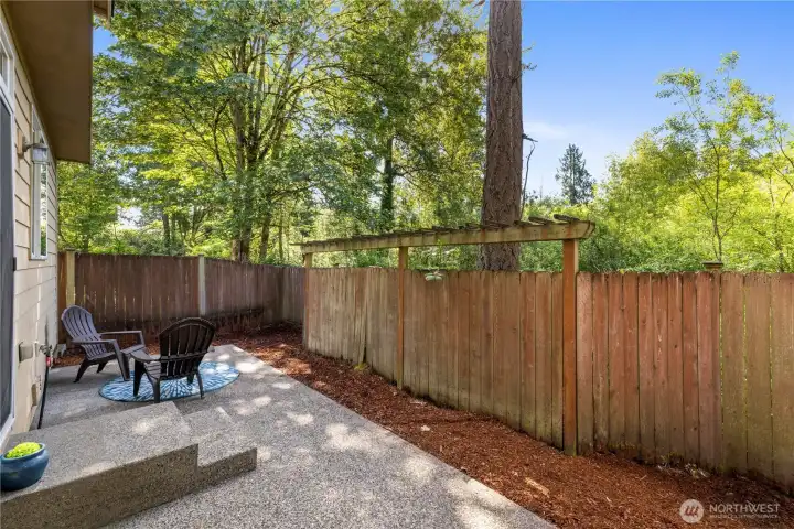 Greenbelt view from the backyard — that tree line gives you true privacy with no rear neighbors looking in.