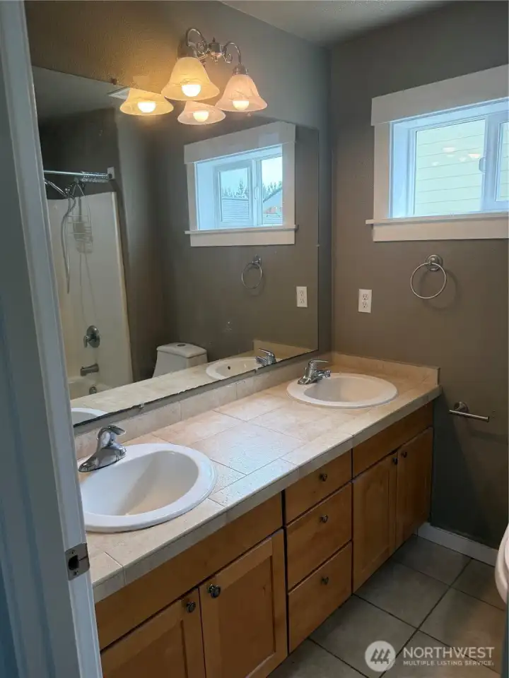 Vanity with double sink off primary bedroom