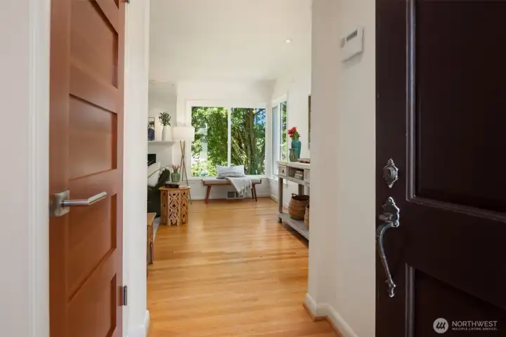 Proper entry way with 2 closets and original hard wood floors. All the doors in the house have been updated to these solid wood doors. Proper entry way with 2 closets and original hard wood floors. All the doors in the house have been updated to these solid wood doors.