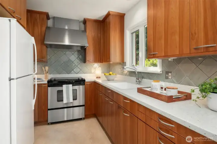 Custom cabinets and Corian counters. The timeless cabinets have handy pull outs. Custom cabinets and Corian counters. The timeless cabinets have handy pull outs.