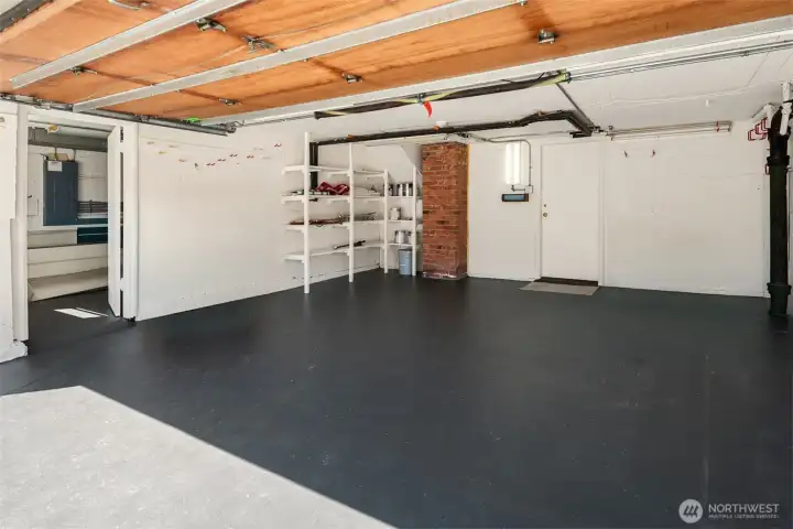 Clean and spacious garage is located a half flight down from the kitchen. The lower level is below it! Clean and spacious garage is located a half flight down from the kitchen. The lower level is below it!