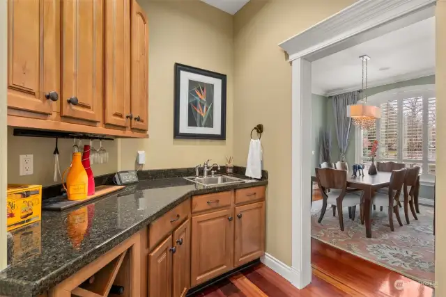 The Butler's pantry from the Kitchen into the Formal Dining room doubles as a bar for easy entertaining.