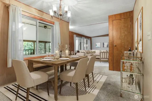 Formal dining room with built in hutch opens to formal living room.  Virtually staged photo.