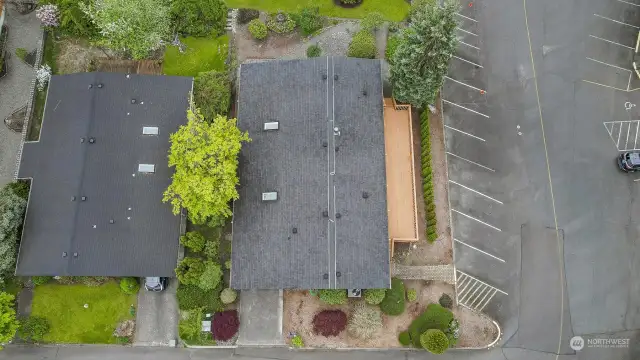 Drone overhead view, with Community greenbelt lawn in the background (HOA mows).