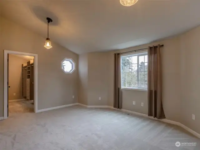 Primary bedroom and one of two walk-in closets