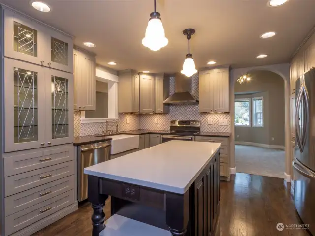 Custom Kitchen with Island double oven and large farmers sink