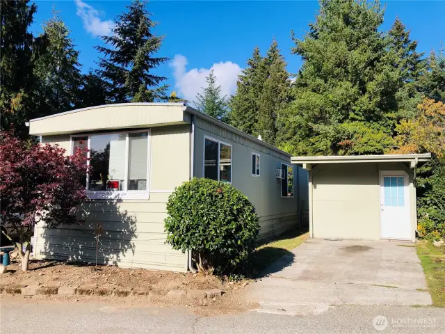 Gig Harbor living that is AFFORDABLE! Enclosed carport offers room for additional storage, office space, covered play area, room for the hobbiest, so many uses! This home is a fixer upper needing cosmetic improvements but the super low price makes up for it!