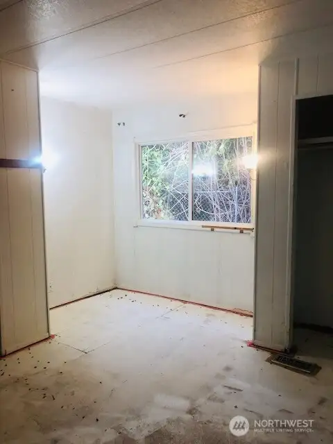 Primary Bedroom - great space for desk or reading area by the window. Carpets have been removed.