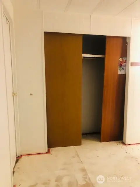 Primary Bedroom - second large closet. Carpets have been removed.