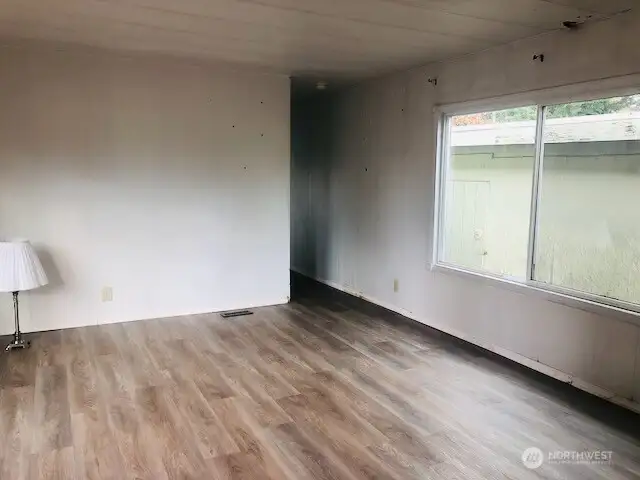 View toward hallway to utility area and bedrooms.