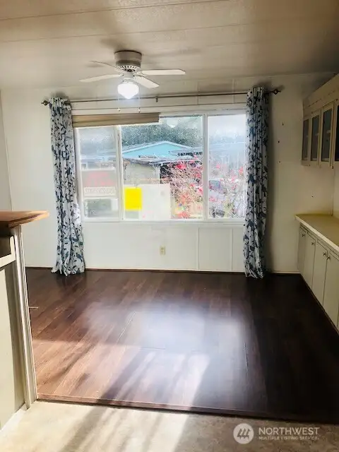 View from the kitchen toward the family room area. Or, use it as a large dining room.