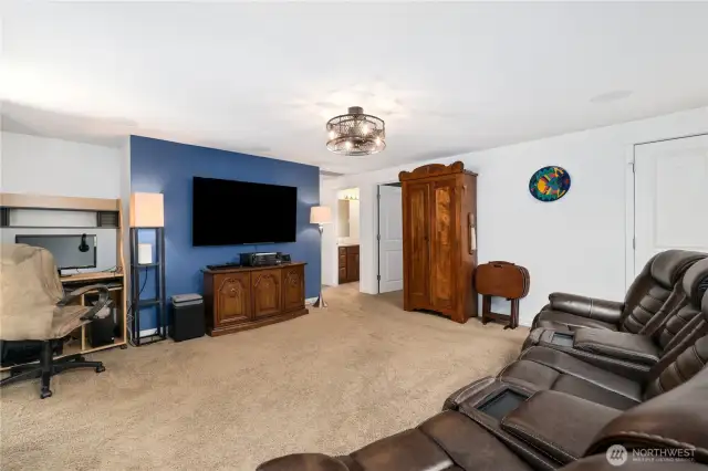 2nd living area with tv and speakers attached into ceiling