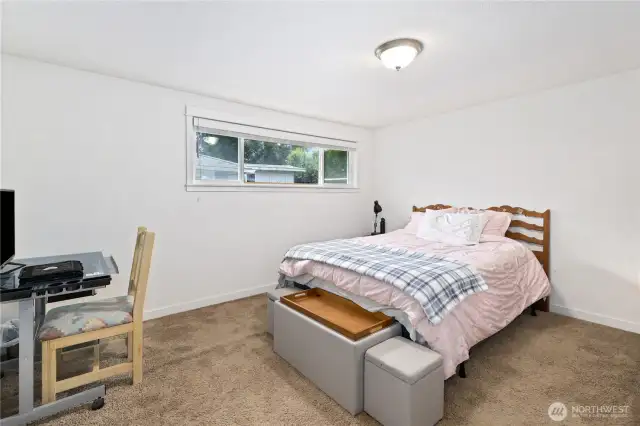 Spacious bedroom with unique windows
