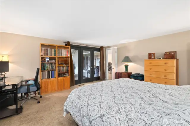 Primary room with glass patio doors for private entrance to back patio
