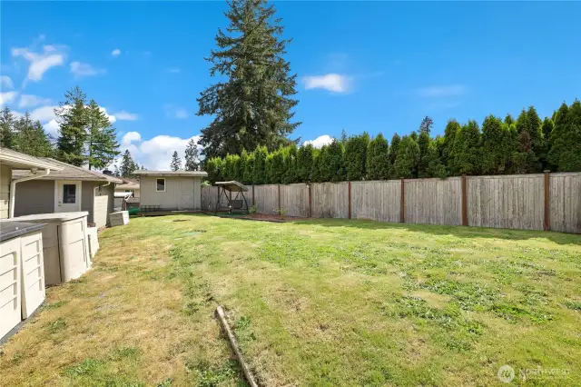 Back yard with fully fenced and trees for great privacy