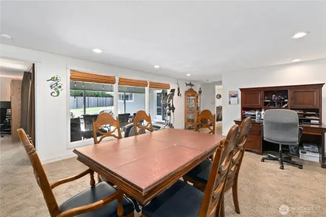 Huge living area with 3 full windows that enter the covered patio