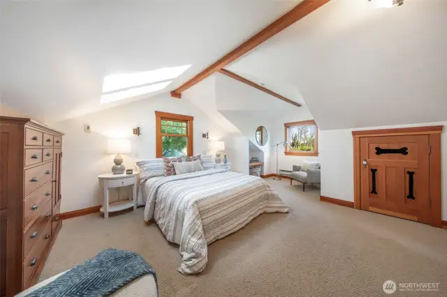Bright primary suite w/skylights & beautiful seating area. "Dog bone room" is extra storage or could be your furry friends favorite nook!