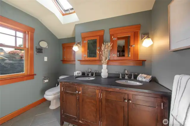 From the closet, enter into the spa-like bathroom that features a steam shower & heated floors