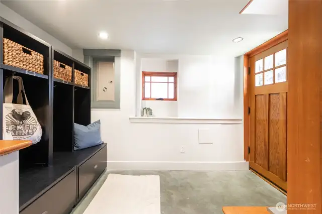 Headed downstairs to the retrofitted basement with 8ft ceilings! Access from the detached garage/driveway makes a perfect mudroom with built-in storage