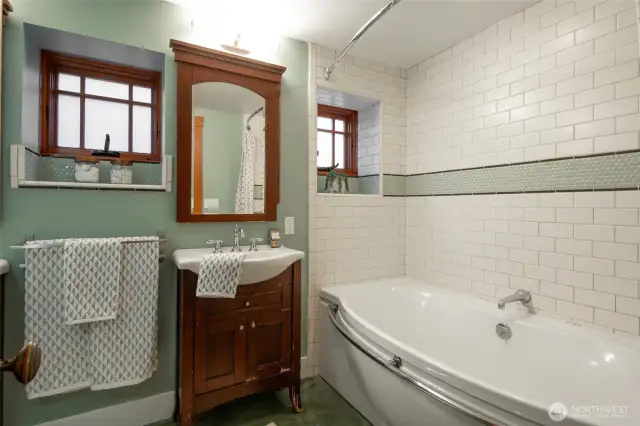 Basement bathroom with updated tile & double vanities