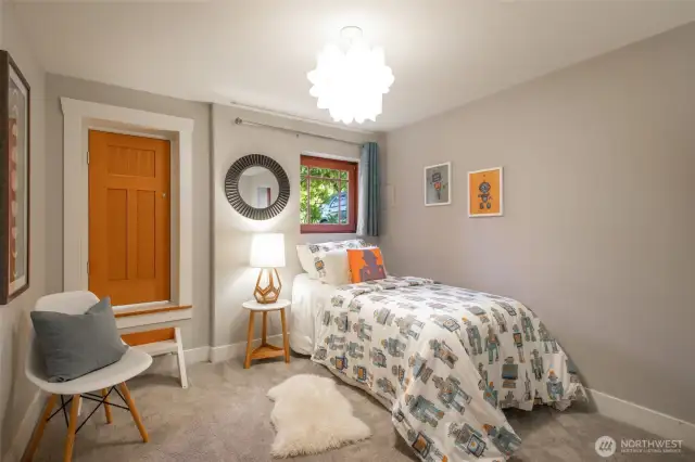 Bedroom #1 in basement- door is a custom closet that connects to other bedroom!