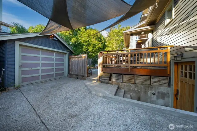 A look at the detached garage & door going down to the basement mudroom area