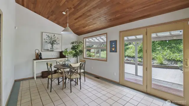 This versatile dining area is bathed in natural light, making it an ideal coffee nook or a cozy corner for casual meals and intimate gatherings