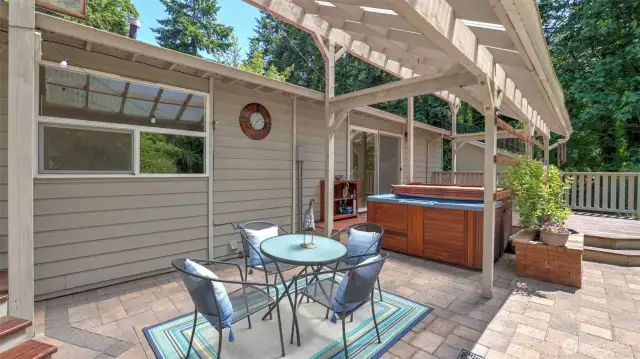 The entertainment sized patio and deck offers plenty of room for tables—a tranquil spot to enjoy morning coffee or unwind after a long day.