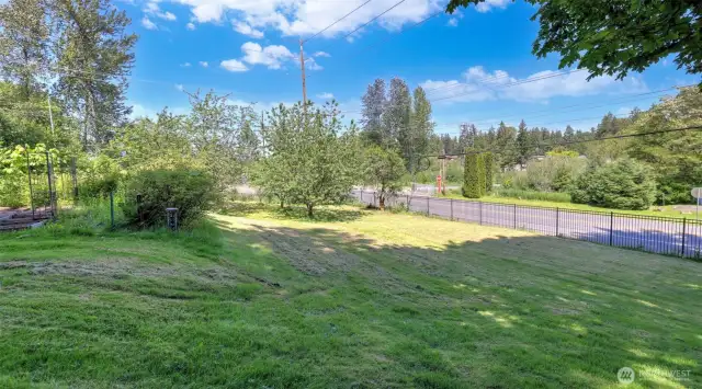 The property features a secure gated entry for added privacy! Located on a large 1.08 acre lot across the street from Soos Creek Trail entry point for added outdoor exploration.