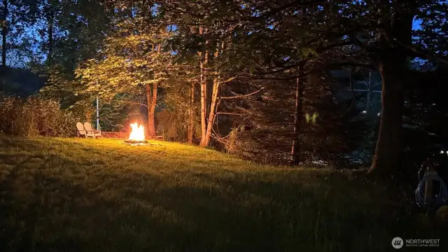 Seller provided photo enjoying a quiet evening around the fire pit in this secluded yard.