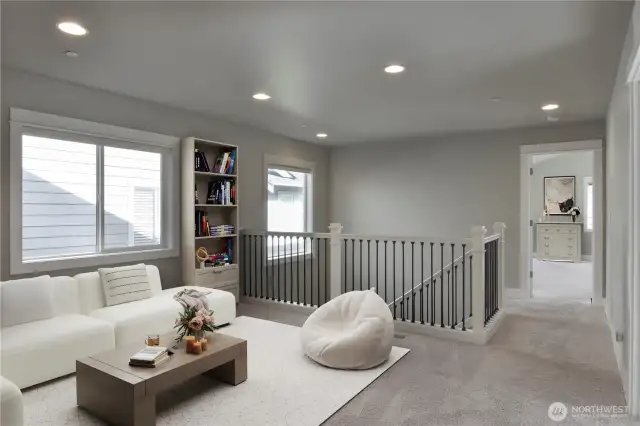 Flexible open loft area that can suit many different needs - media, study, office, play area, etc. (Virtually Staged as lounge and reading nook)