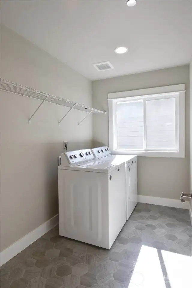 Spacious laundry room with natural light
