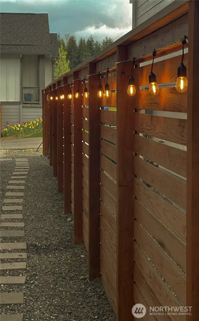 Side of house lighted walk way to reach front door