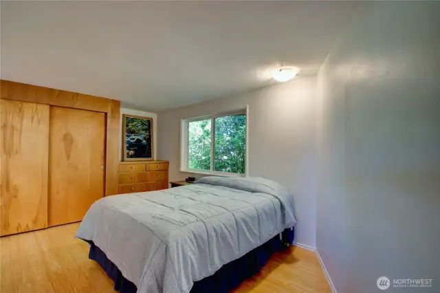 Primary bedroom with built in drawers.
