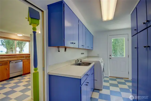 Laundry room has access to driveway, access to the bonus room and there is a bathroom.