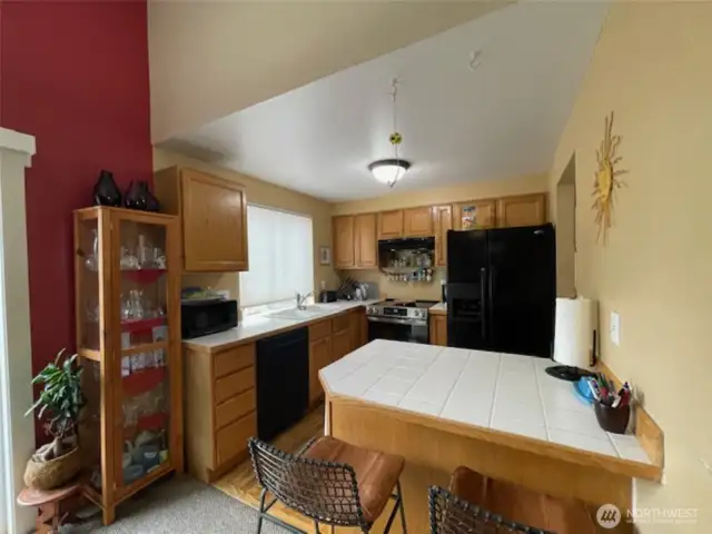 Snack bar off of kitchen.