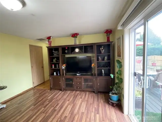 Family room located at opposite end from living room on the main.