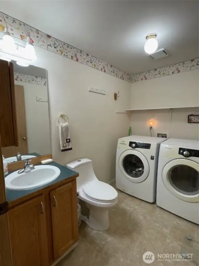 half bathroom/utility room off of family room.
