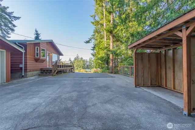 Long drive with plenty of room for parking along with large 2 car garage