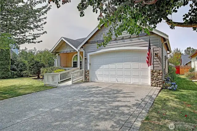 Two car garage with ample parking space.