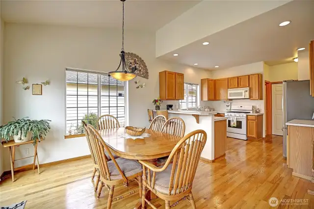 Large dining room that flows seamlessly into the kitchen and living room.