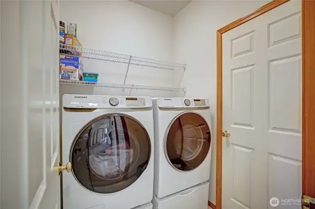 Large mud room/laundry room that enters into spacious 2 car garage.