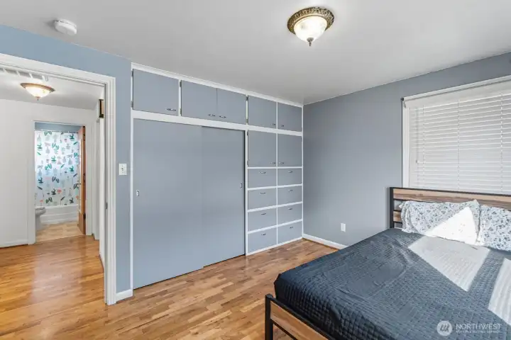 Primary bedroom with built-in storage.
