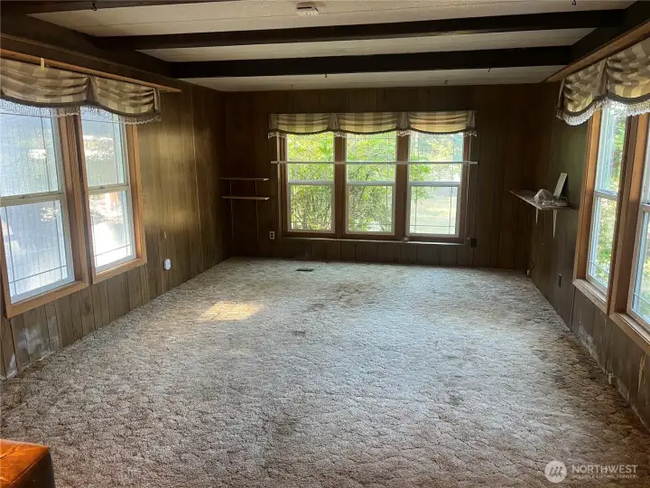 Huge living/dining area with newer windows.