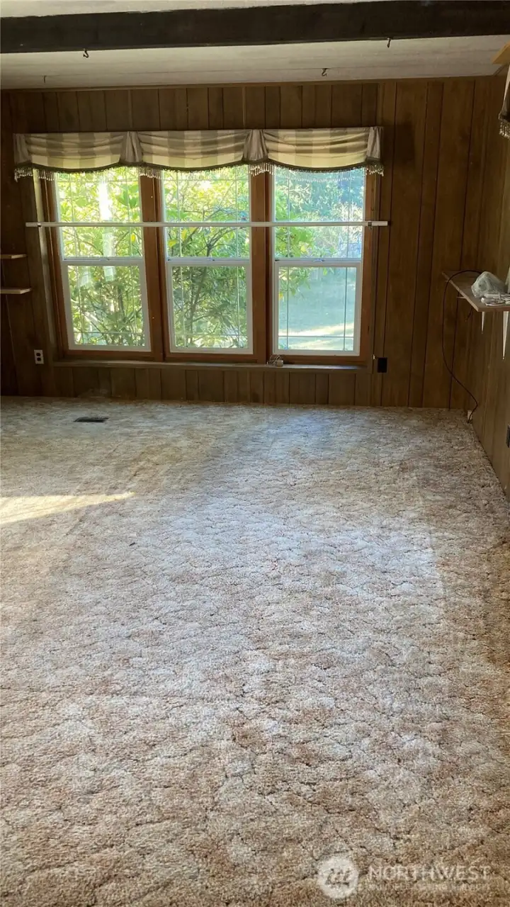 Huge living/dining area with newer windows.